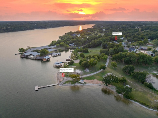 aerial view at dusk with a water view