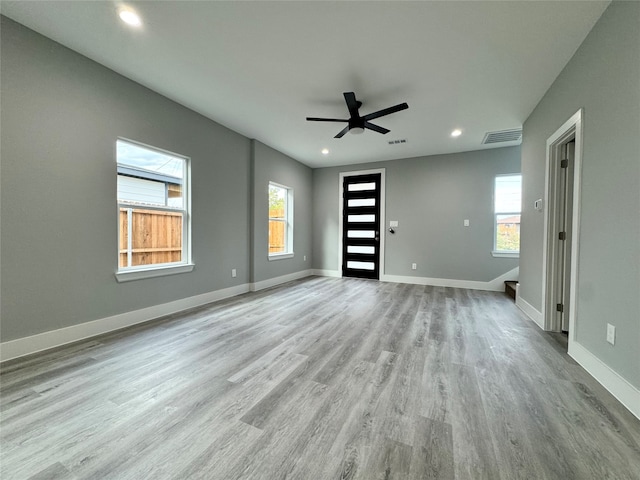 interior space with light hardwood / wood-style floors and ceiling fan