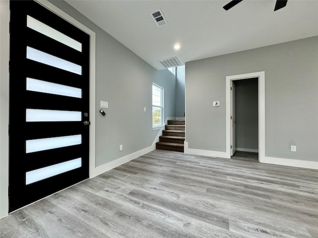 entrance foyer with ceiling fan and light hardwood / wood-style floors