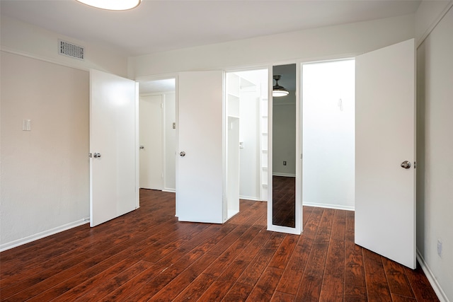 unfurnished bedroom featuring dark wood-type flooring