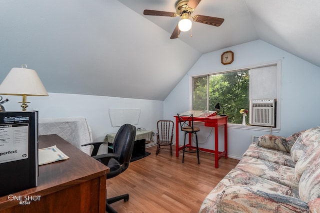 office featuring baseboards, ceiling fan, vaulted ceiling, cooling unit, and light wood-type flooring