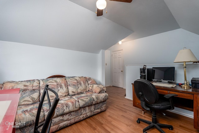 office space with light wood-style floors, lofted ceiling, and ceiling fan