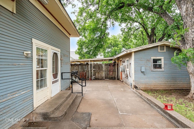 view of patio featuring fence