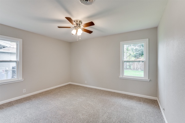 spare room featuring carpet floors and ceiling fan