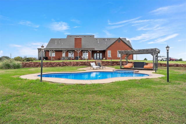 view of pool with a pergola, an in ground hot tub, a yard, and a patio