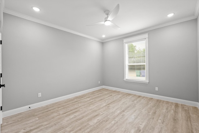 spare room featuring ceiling fan, light wood-type flooring, and crown molding