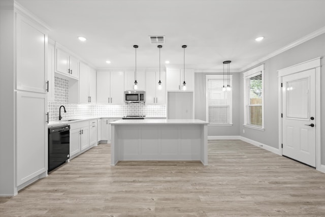 kitchen with white cabinetry, dishwasher, a kitchen island, and ornamental molding