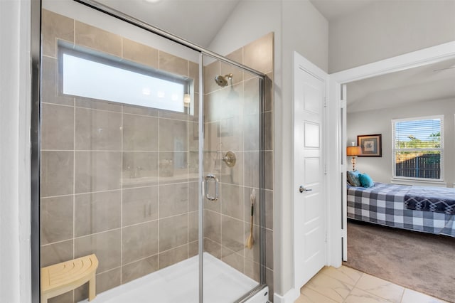 bathroom featuring lofted ceiling and walk in shower