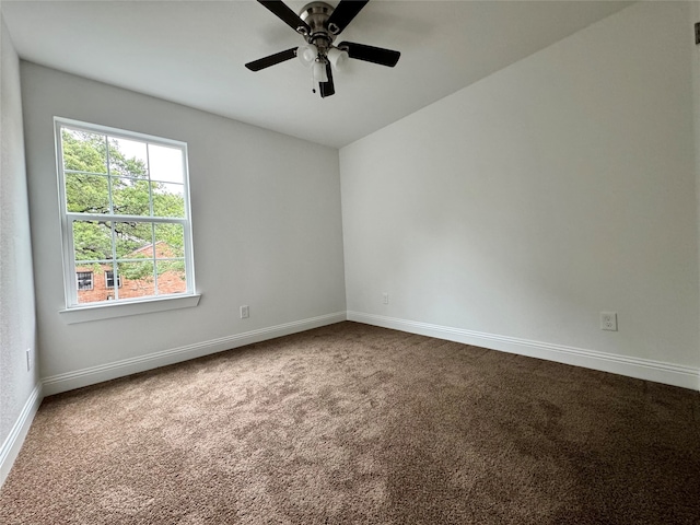 spare room featuring carpet and ceiling fan