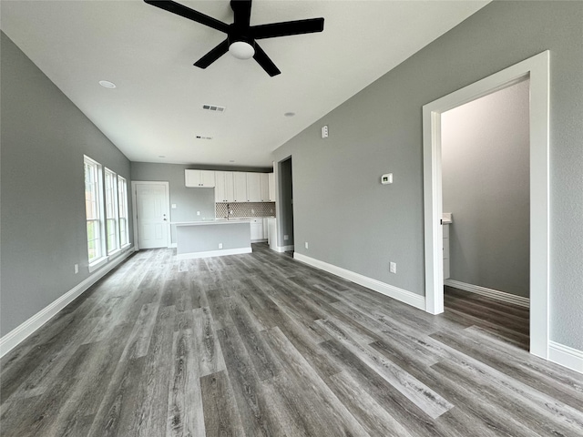 unfurnished living room featuring light hardwood / wood-style flooring and ceiling fan