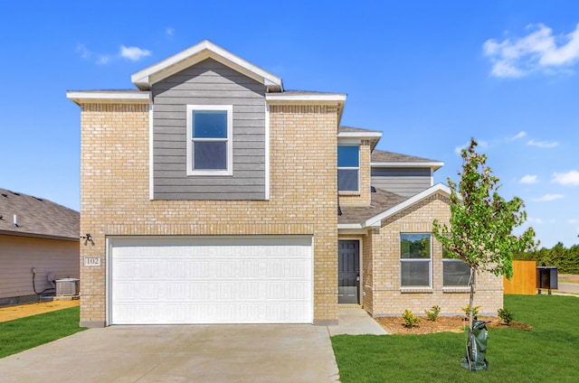 view of front of house with a garage, central AC, and a front yard