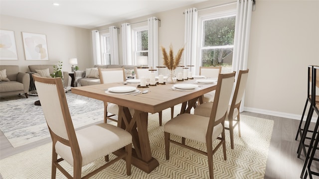 dining room featuring plenty of natural light and light hardwood / wood-style floors