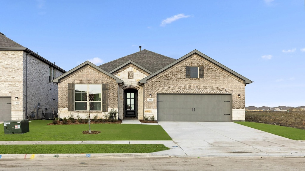 french provincial home featuring a garage, central AC, and a front lawn