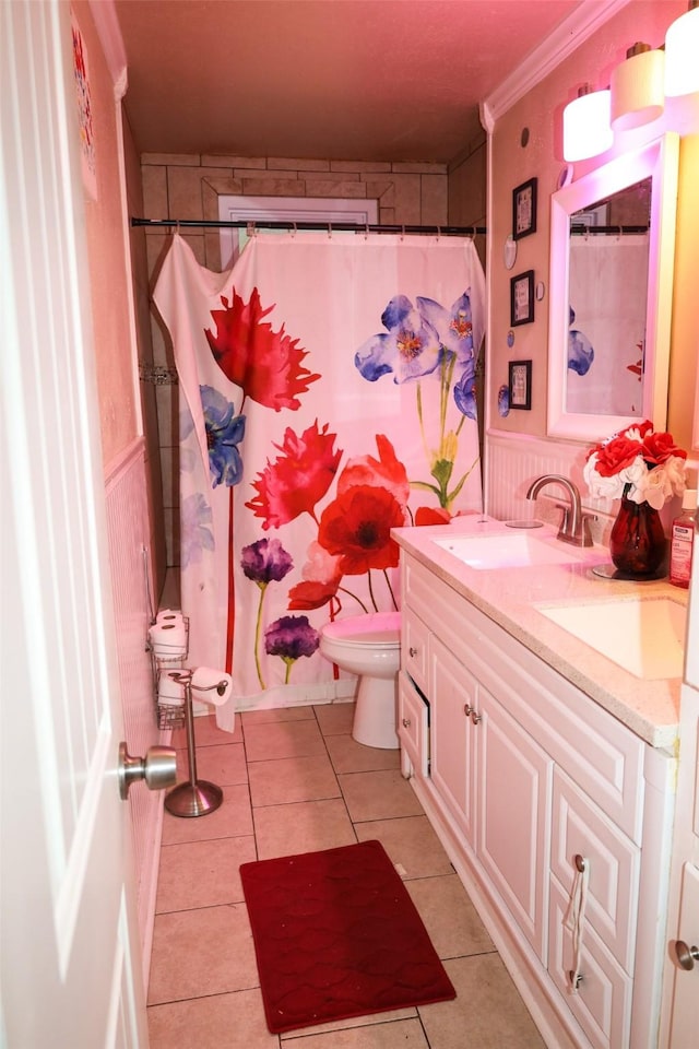 bathroom with toilet, crown molding, a shower with curtain, vanity, and tile patterned flooring