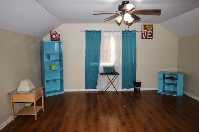 interior space with lofted ceiling, ceiling fan, and dark wood-type flooring