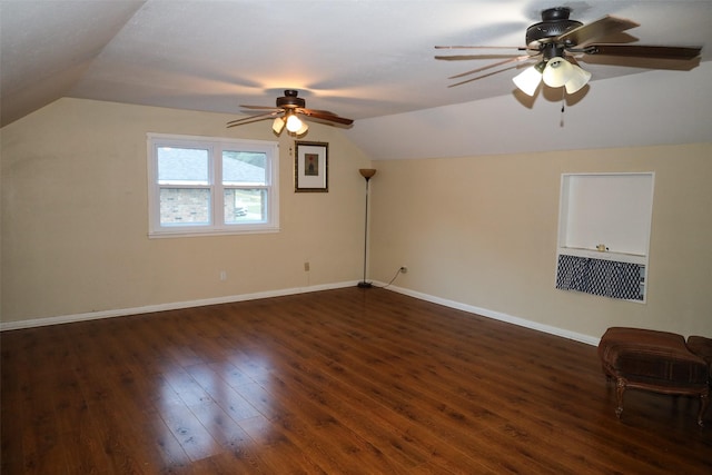 bonus room featuring vaulted ceiling, dark hardwood / wood-style floors, and ceiling fan