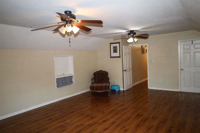 unfurnished room featuring ceiling fan, dark hardwood / wood-style flooring, and lofted ceiling