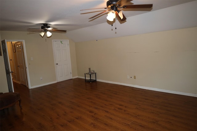 unfurnished room featuring dark wood-type flooring, ceiling fan, and vaulted ceiling