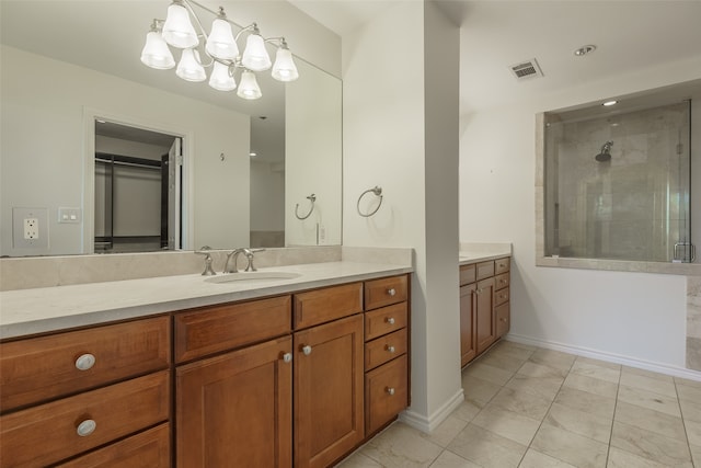 bathroom featuring tile patterned flooring, vanity, and an enclosed shower