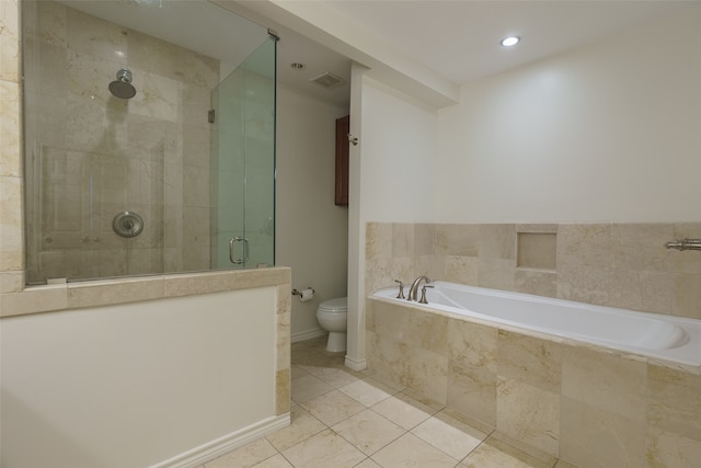 bathroom with tile patterned floors, toilet, and independent shower and bath