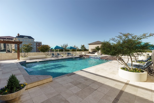 view of swimming pool with a patio area