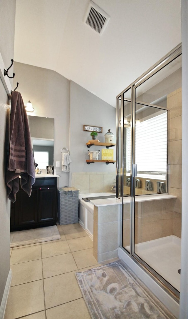 bathroom with tile patterned floors, plenty of natural light, an enclosed shower, and lofted ceiling