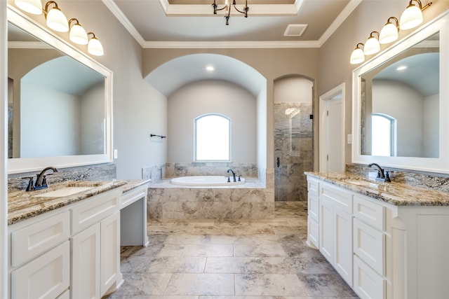 bathroom featuring vanity, crown molding, and shower with separate bathtub