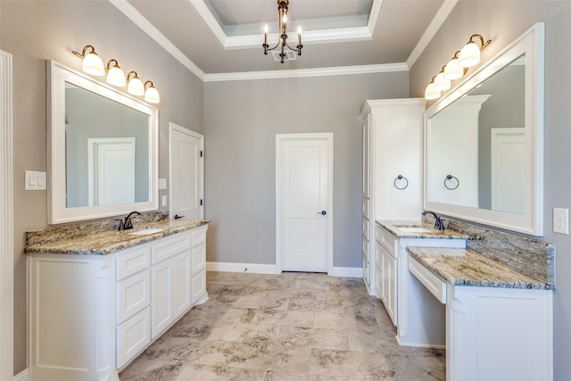 bathroom featuring vanity, a chandelier, crown molding, and a tray ceiling