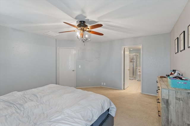 carpeted bedroom with connected bathroom and ceiling fan