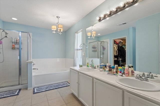 bathroom featuring vanity, tile patterned floors, separate shower and tub, and an inviting chandelier