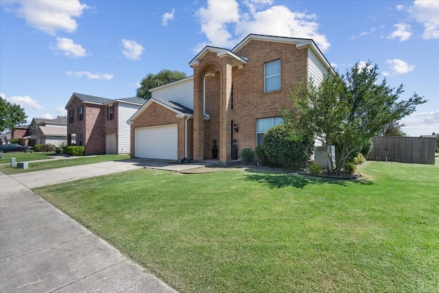 view of front of home featuring a garage and a front lawn