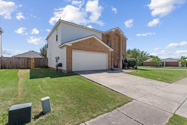 view of front property featuring a front yard and a garage