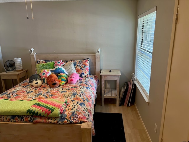 bedroom with light wood-type flooring