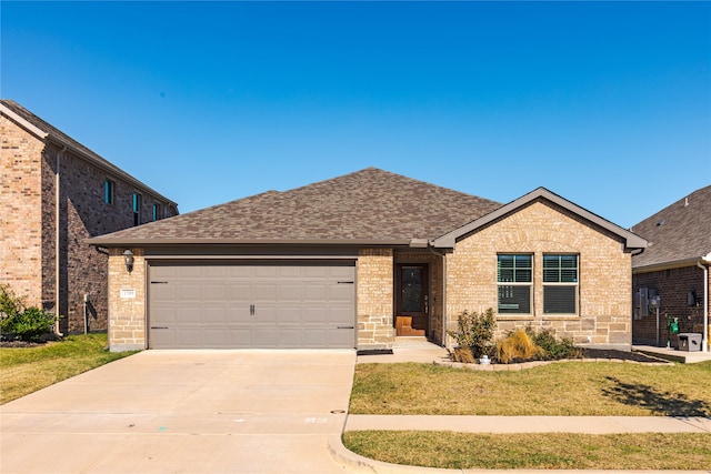 single story home featuring a front yard and a garage