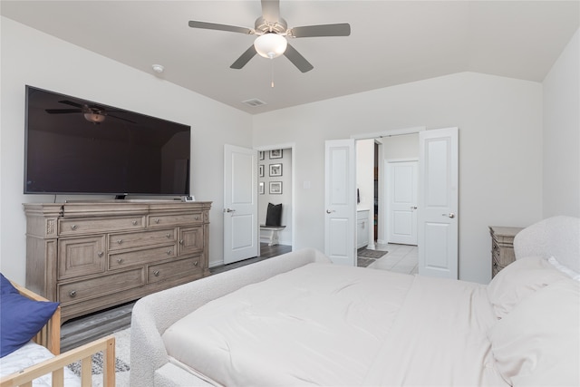 bedroom featuring ceiling fan and vaulted ceiling