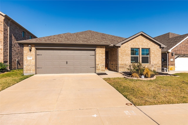 single story home with a garage and a front yard