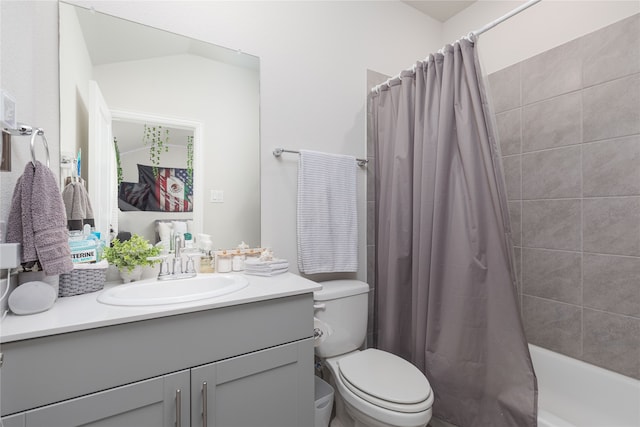 full bathroom with shower / bath combo with shower curtain, vanity, and toilet