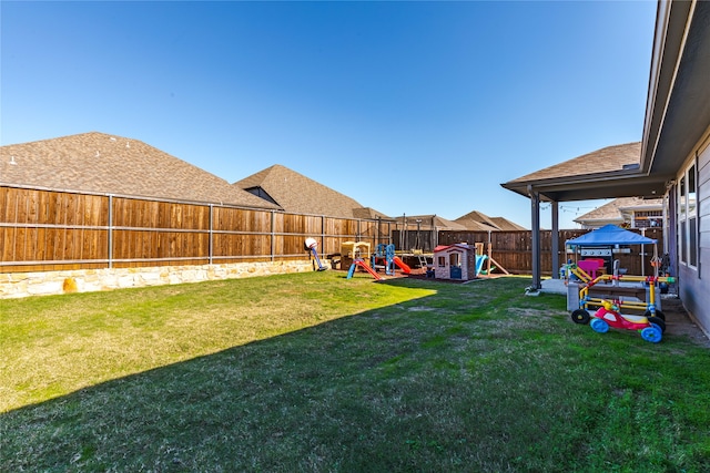 view of yard with a playground