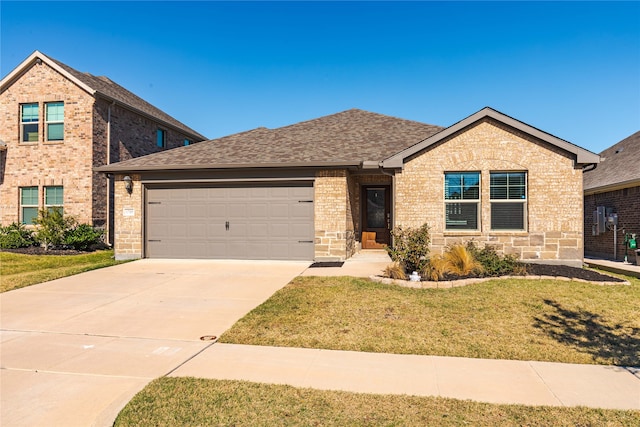 view of front of home with a garage and a front yard