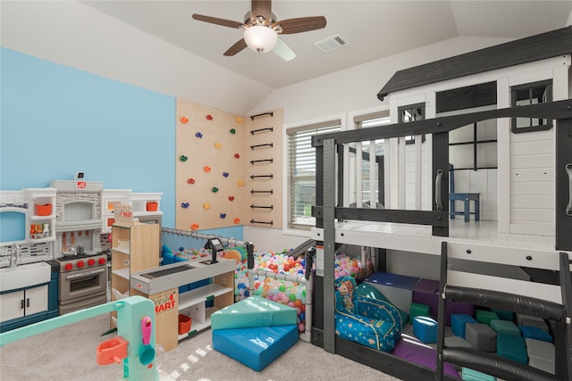 playroom featuring ceiling fan, sink, carpet, and vaulted ceiling