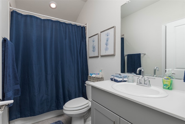 bathroom featuring vanity, vaulted ceiling, tile patterned flooring, toilet, and curtained shower