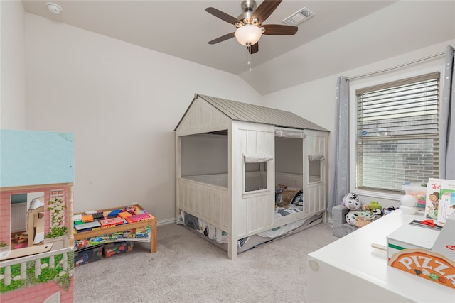 bedroom featuring ceiling fan, light carpet, and vaulted ceiling