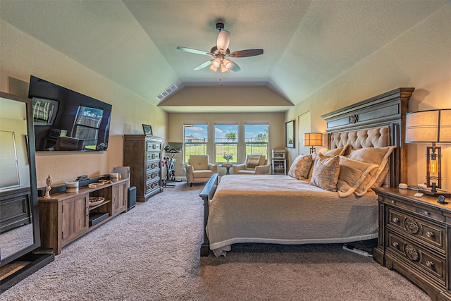 bedroom featuring ceiling fan, carpet floors, a textured ceiling, and vaulted ceiling