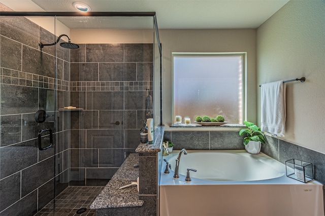 bathroom with shower with separate bathtub