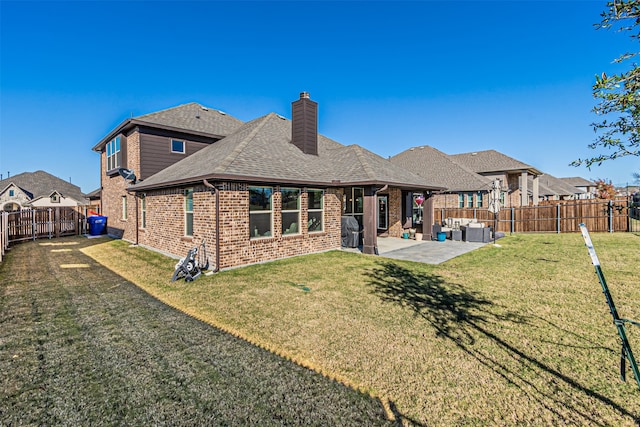 rear view of property with a lawn, a patio, and an outdoor hangout area