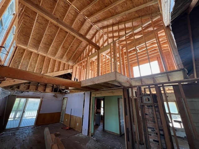 misc room with high vaulted ceiling