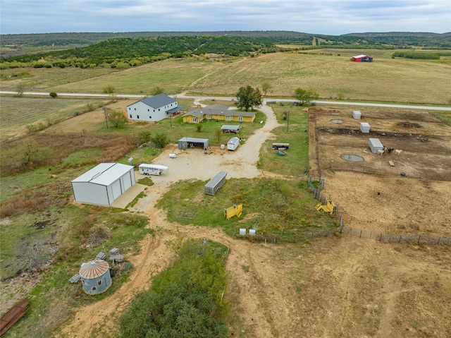 birds eye view of property featuring a rural view