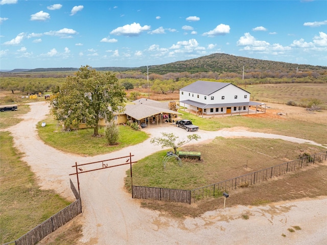 birds eye view of property featuring a mountain view and a rural view