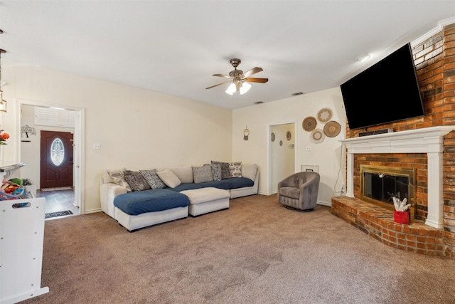 living room featuring carpet flooring, ceiling fan, and a fireplace