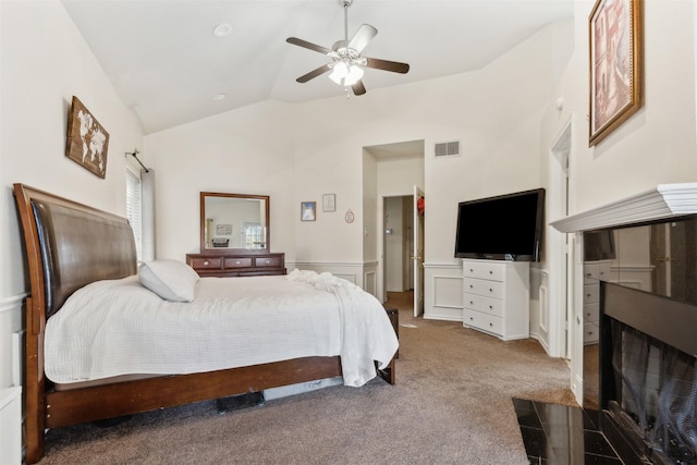 bedroom featuring ceiling fan, lofted ceiling, and carpet floors